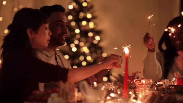 Happy Friends Having Christmas Dinner at Home