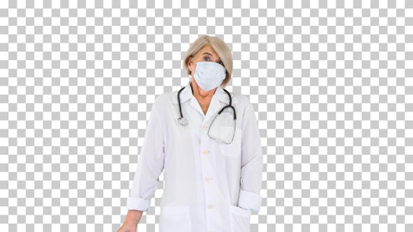 Senior doctor putting on medical mask, Alpha Channel