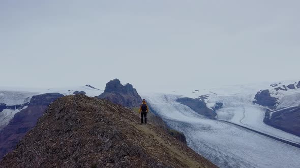 Tourist Climbs To the Top of Kristinartindar