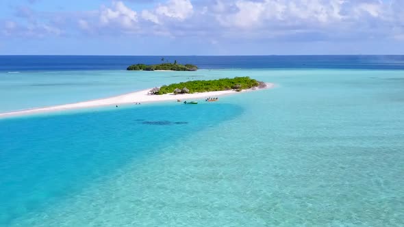 Aerial drone travel of seashore beach trip by blue lagoon with sand background