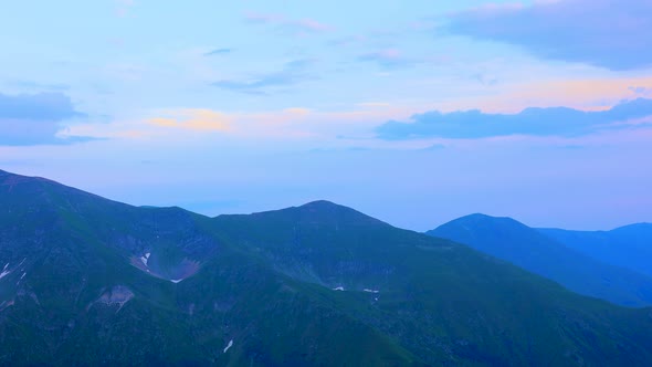 Time Lapse of a Silhouetted Blue Mountains and Horizon at Fagaras Mountains