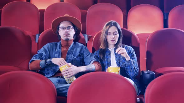 Cinema Hall with a Couple Watching a Movie