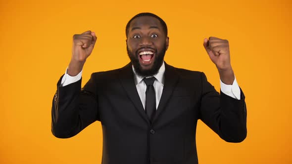 Cheerful African-American Businessman Making Yes Gesture, Successful Startup