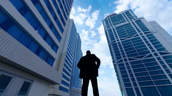 Silhouette Of Successful Business People Standing Under Tall Buildings