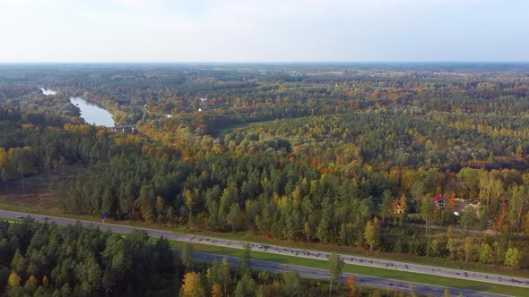 Latvia, A2 Highway Autumn Landscape From Above. Gauja River With Bridge and Ramkalni in Background.