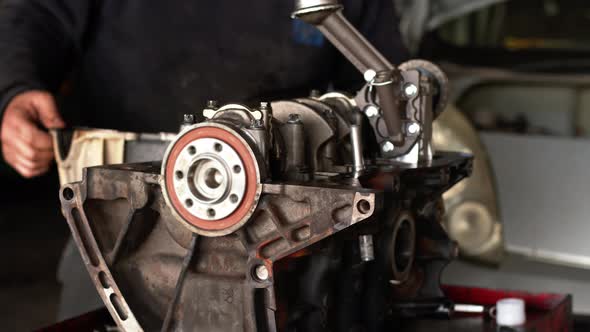 Repairing The Old Car Engine Cylinder Block In The Workshop