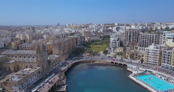 Spinola Bay with Traditional maltese Luzzu