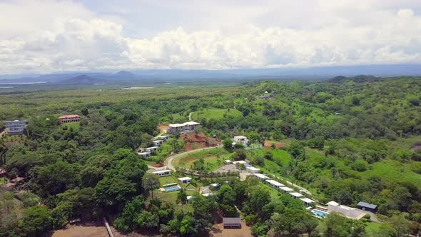 Aerial drone shot of resort in Boca, Chica, Panama with beautiful forest, sky and mountain backgroun
