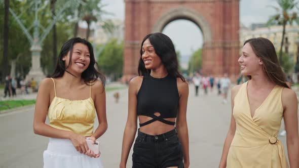 Three Joyful Happy Diverse Young Women Best Friends Enjoying Sightseeing Europe City Together