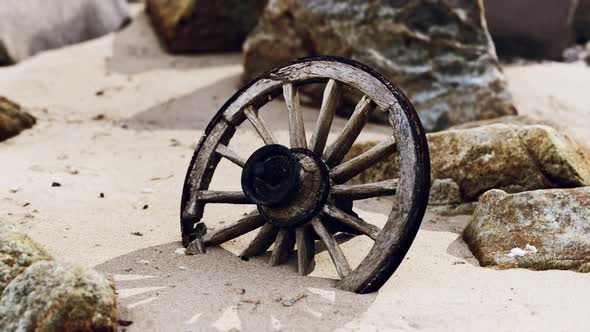 Old Tradition Waggon Wheel on the Sand