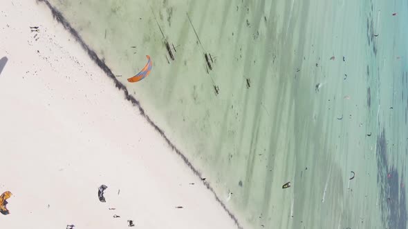 Zanzibar Tanzania  Vertical Video Kitesurfing Near the Shore of Ocean Slow Motion