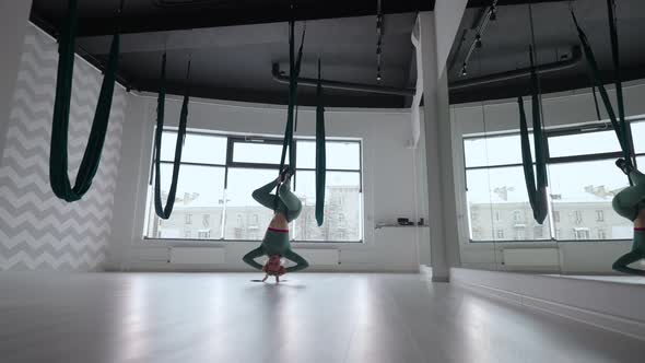 Young Beautiful Woman Practice in Aero Stretching Swing