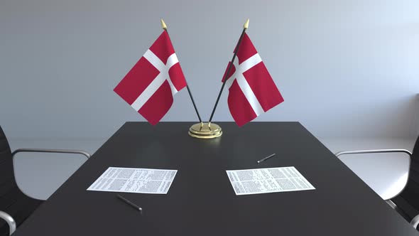 Flags of Denmark and Papers on the Table alt