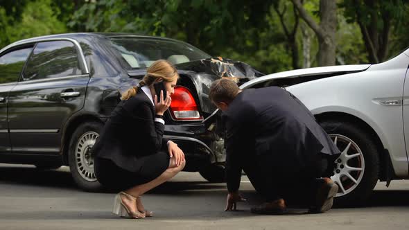 Female Driver Calling Insurance Company After Road Accident, Rear-End Collision