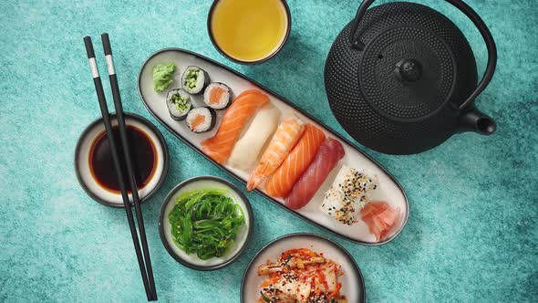 Asian Food Assortment. Various Sushi Rolls Placed on Ceramic Plates