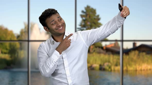 Handsome Businessman Taking Selfie with Smartphone