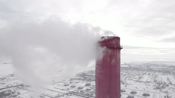 White Smoke From A Chimney On A Winter Background