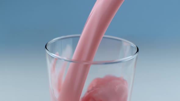 Strawberry milk pouring and splashing in slow motion; shot on Phantom Flex 4K at 1000 fps alt