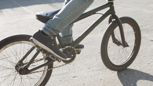 Person Riding a Bike Outdoors on a Walkway Alongside a Canal Close Up View of the Sole and Underside