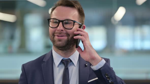 Middle Aged Businessman Talking on Phone