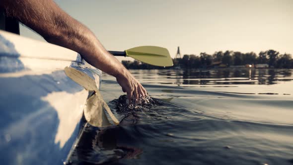 Close Up Man Hand Splashing Water Enjoying Touching Waves Sliding  With Fingers On Surface Summer.