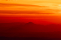 Tranquil landscape of layered mountains silhouettes during colorful sunrise, Slovakia - PhotoDune Item for Sale