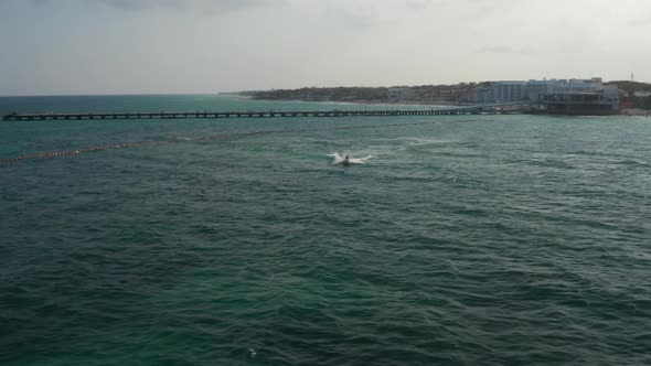 Aerial View with Two Males Riding the Waves with Jet Ski on Caribbean Sea