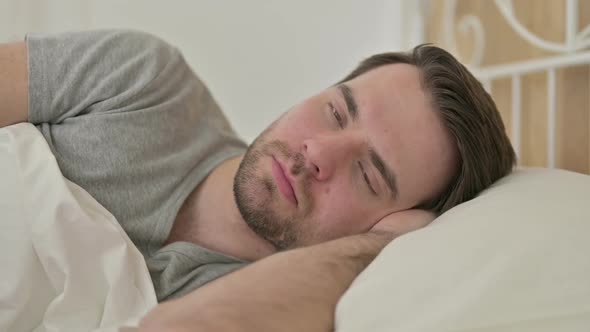 Portrait of Beard Young Man Thinking in Bed