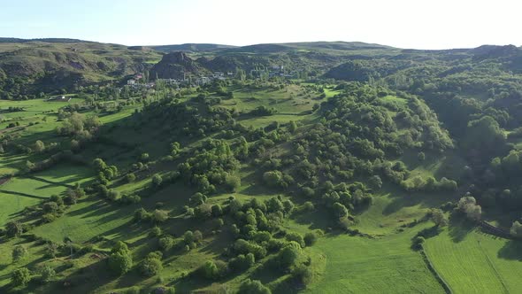 Aerial View Of Trees Green Meadows And Hills