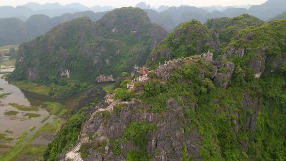 Aerial Shot of the Small Temple and a Dragon on the Top of Marble Mountain Mua Cave Mountain in Ninh