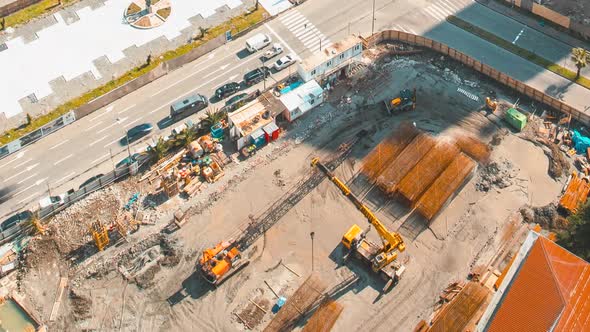 Various Machinery Cranes With Workers Are Engaged In Repairing Development On Construction Site alt
