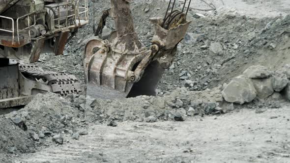 Scoop Of Excavator Is Digging Hole alt