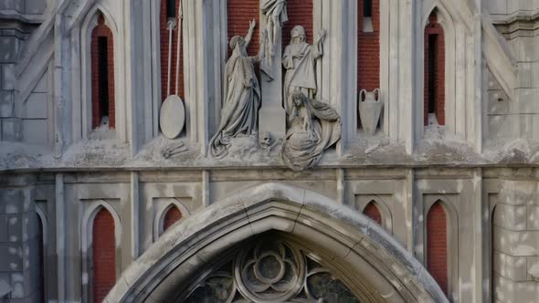 Closeup Old Ancient Roman Catholic Church with Jesus Christ