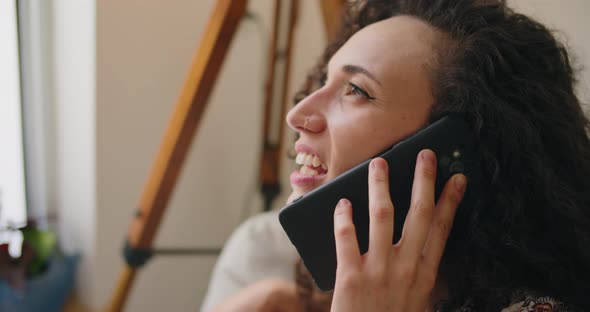 Woman talking on the phone at home