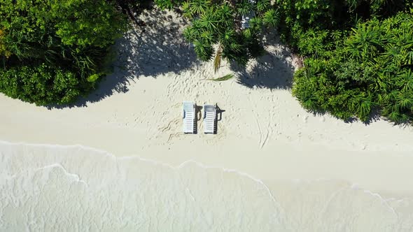 Aerial landscape of idyllic coast beach time by blue green water with white sand background of a day