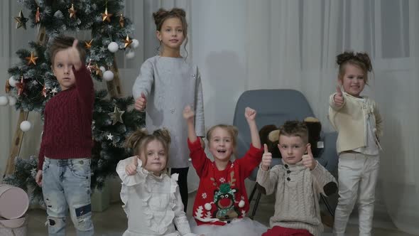 A group of children with New Year's gifts, happy friends for Christmas
