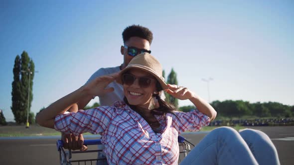 Young Friends Having Fun on Shopping Trolleys