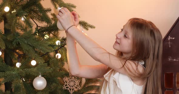 Happy Pretty Girl in an Elegant Dress Getting Ready To Celebrate the New Year