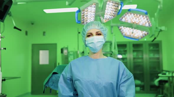 Young Medical Doctor Shows Thumbs Up Sign and Smiles