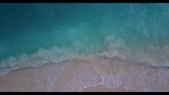 Aerial drone view seascape of marine coast beach break by transparent water and white sandy backgrou