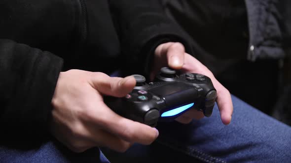 Young Man Plays Video Game in Amusement Center Closeup