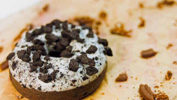 Chocolate Donuts Decorated with Pieces of Oreo Biscuits