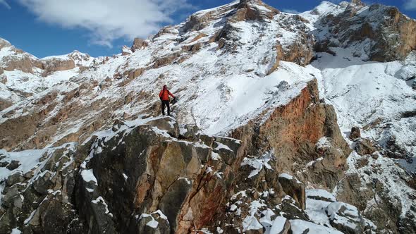 Mountaineer Looks Around In Peak