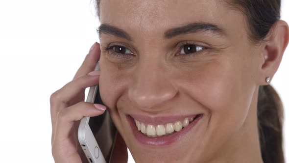 Latin Woman Talking on Mobile Phone
