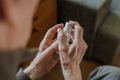 Senior disinfects hands with antibacterial gel - PhotoDune Item for Sale