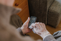 Old Man Cleaning phone to prevent Covid-19 infection - PhotoDune Item for Sale