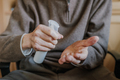 Old man disinfects hands with antibacterial liquid - PhotoDune Item for Sale