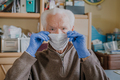 Old man wearing protective mask and gloves - PhotoDune Item for Sale