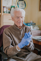 Portrait of Old man wearing Protective Gloves against Covid-19 - PhotoDune Item for Sale