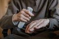 Old man disinfects hands with antibacterial liquid - PhotoDune Item for Sale